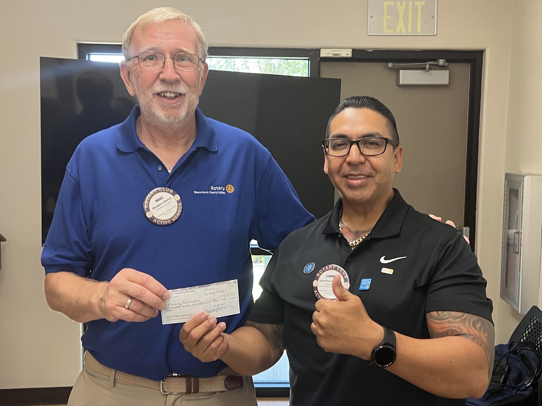 Samuel Bermudez Valdez and President Doug Emery celebrate Sammy's Chase the Card win